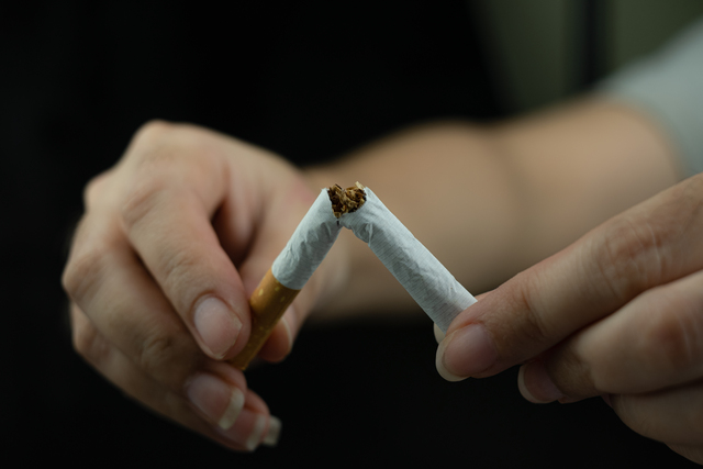 Women hand crushing cigarette, Concept Quitting smoking world no tobacco day